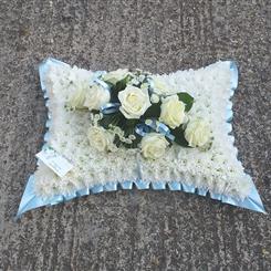 Pale blue and white pillow